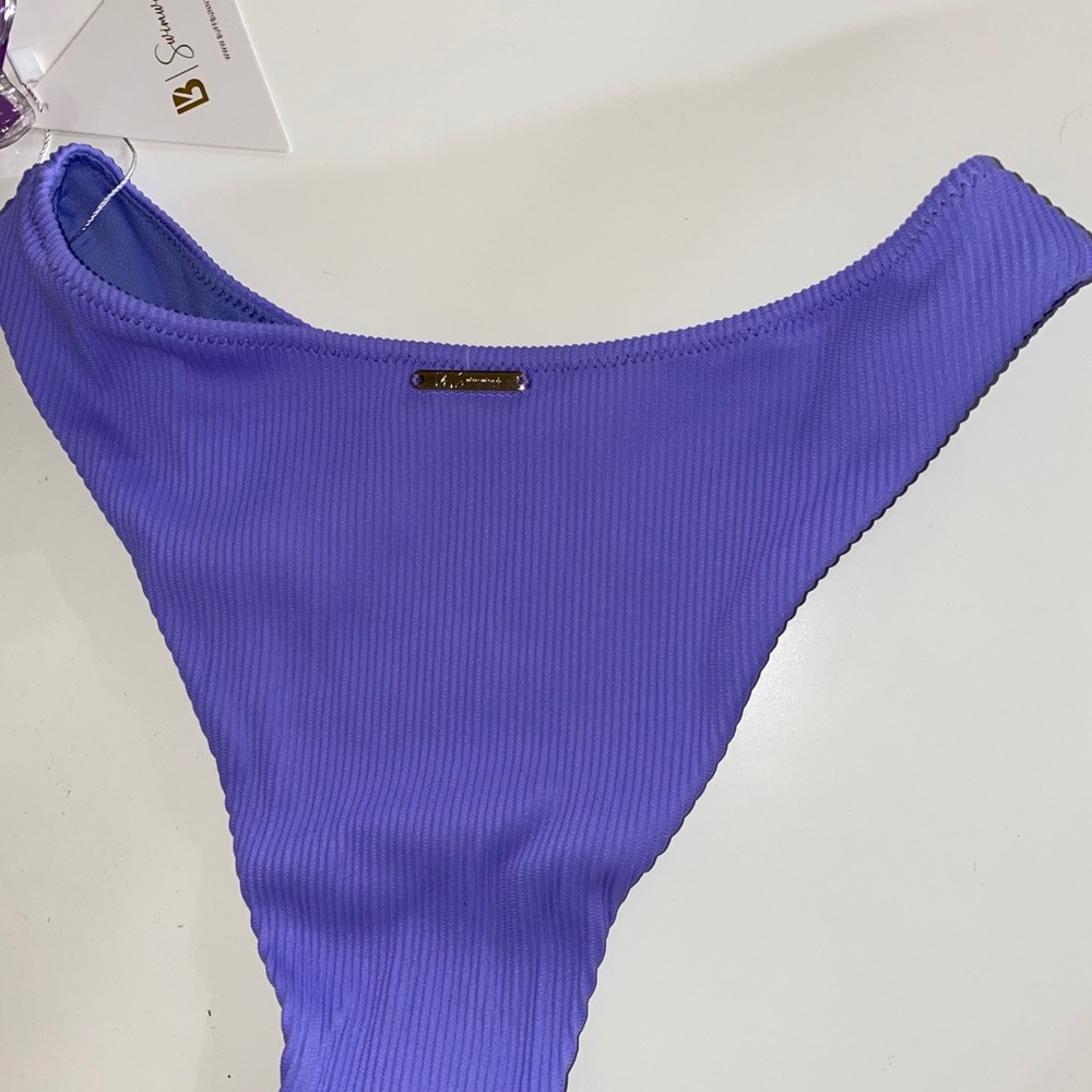 Buff bunny swimsuit the lavender bottom,